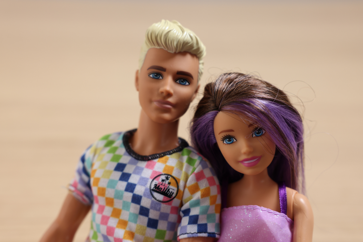 A closeup of Ken and Barbie dolls.